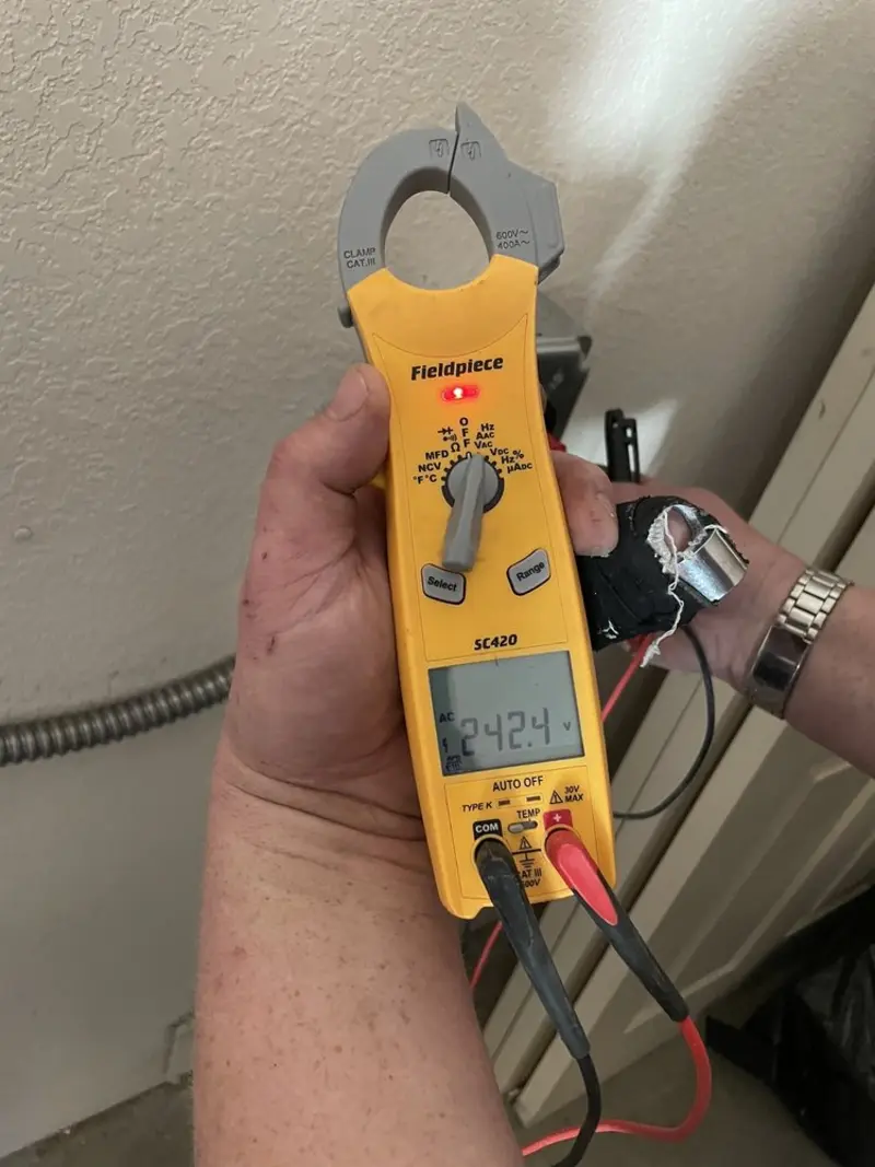 Voltage testing with clamp meter during Generator Installation in North Fort Lewis